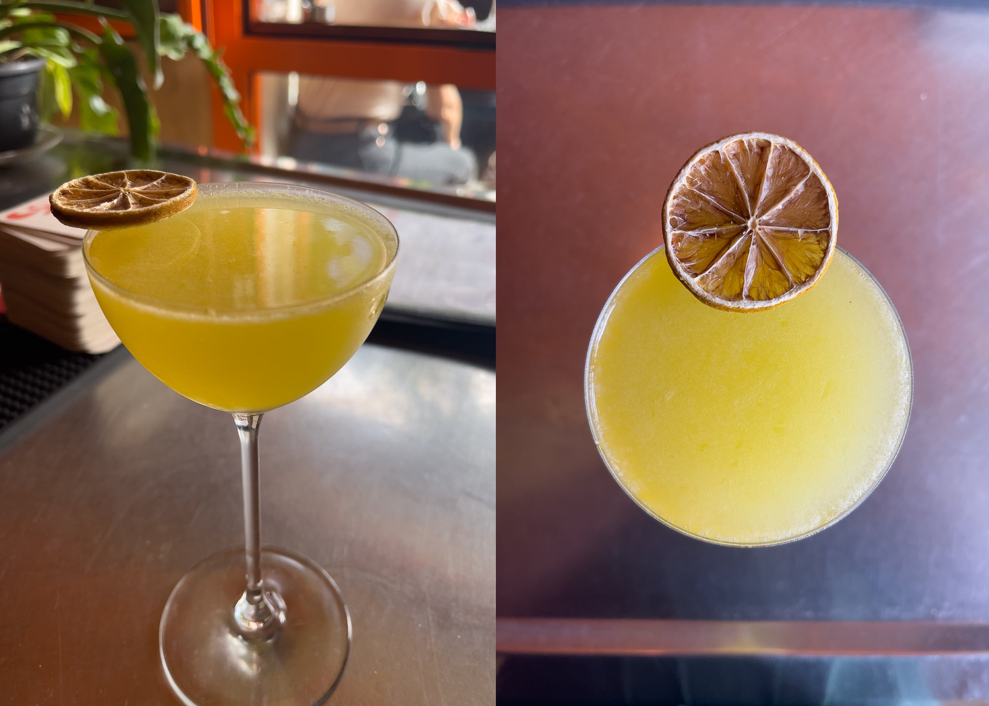 yellow kumquat yuzu cocktail in martini glass with dried yuzu slice on top for decoration