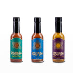 Front view of ONIMA Pantry Hot Sauce Trio Bundle with IL MIG+, Lemon Ginger Jerk, and Cajun Sumac sauces