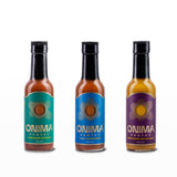 Front view of ONIMA Pantry Hot Sauce Trio Bundle with IL MIG+, Lemon Ginger Jerk, and Cajun Sumac sauces