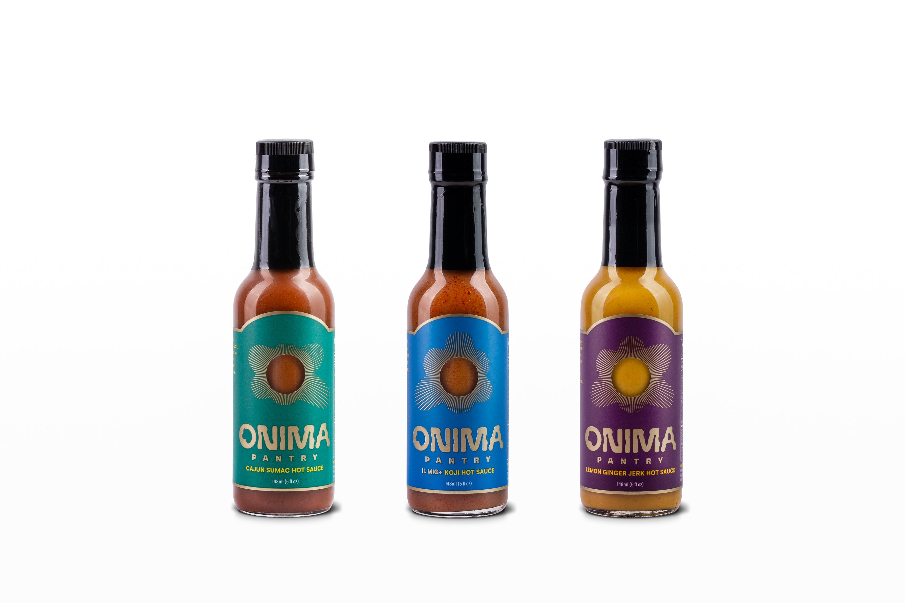 Front view of ONIMA Pantry Hot Sauce Trio Bundle with IL MIG+, Lemon Ginger Jerk, and Cajun Sumac sauces