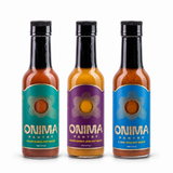 Cooking Trio bundle: one bottle each of Cajun Sumac, Lemon Ginger Jerk, Habanero Koji on a white background. Habanero Koji is pictured in IL MIG+ packaging.