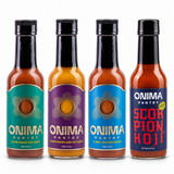 Heat Ladder bundle: one bottle each of Cajun Sumac, Lemon Ginger Jerk, Habanero Koji, Scorpion Koji on a white background. Habanero Koji is pictured in IL MIG+ packaging.