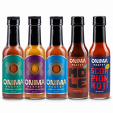 Pantry Five bundle: one bottle each of Cajun Sumac, Lemon Ginger Jerk, Habanero Koji, Mole, Scorpion Koji on a white background. Habanero Koji is pictured in IL MIG+ packaging.